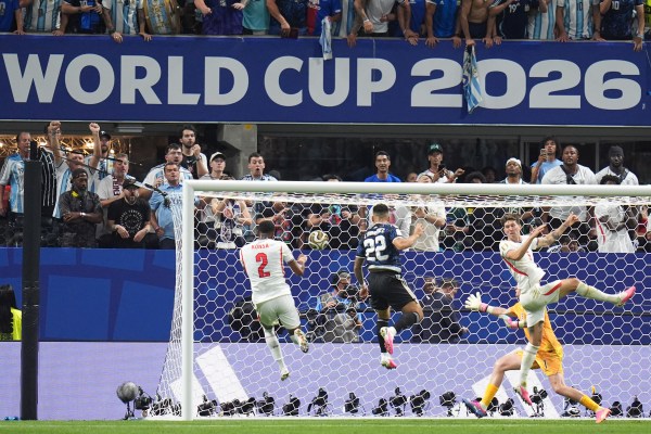 Argentina's Lautaro Martinez (22) fires in the winner from Messi's cross. (AP Photo/Jeff Roberson)