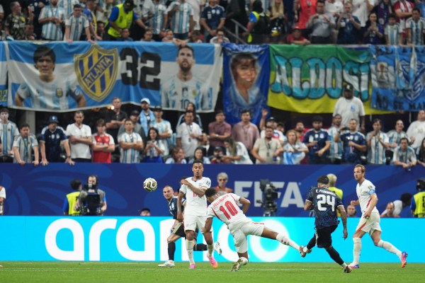Argentina's Enzo Fernandez (24) scores their opening goal from a Messi assist in the 85th minute. (AP Photo/Jeff Roberson)