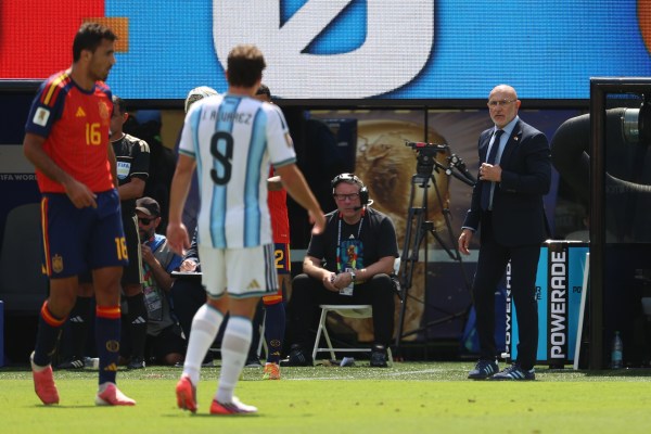 Spain head coach Luis de la Fuente, right, watches action during the World Cup final match against Argentina. (AP Photo/Pamela Smith)