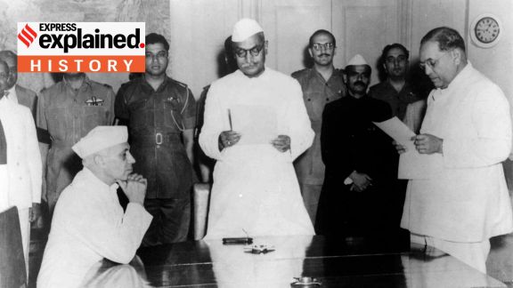 Dr B R Ambedkar being administered the oath of office and seceracy by President Dr. Rajendra Prasad. Pt. Jawahar Lal Nehru sits in front of Ambedkar.