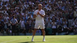 Arthur Fery of Britain reacts to winning against Flavio Cobolli of Italy in their quarter-final men's singles match at the Wimbledon Tennis Championships in London, Wednesday, July 8, 2026. (AP Photo/Brian Inganga)