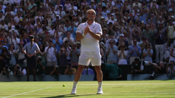 Arthur Fery of Britain reacts to winning against Flavio Cobolli of Italy in their quarter-final men's singles match at the Wimbledon Tennis Championships in London, Wednesday, July 8, 2026. (AP Photo/Brian Inganga)