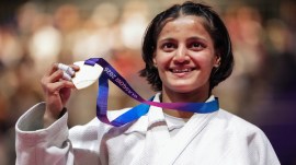 India's Asmita Dey poses with her gold medal during the victory ceremony for the Women's 48kg judo event at the Commonwealth Games 2026, in Glasgow, Scotland, Friday, July 31, 2026. Asmita became the first Indian judoka to win a Commonwealth Games gold medal. (PTI Photo)