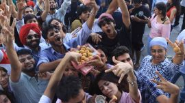 Protesters celebrate after the resignation of Dharmendra Pradhan (Express)