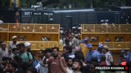 Cockroach Janata Party (CJP) supporters gather during a protest march. (Express Photo by Praveen Khanna)