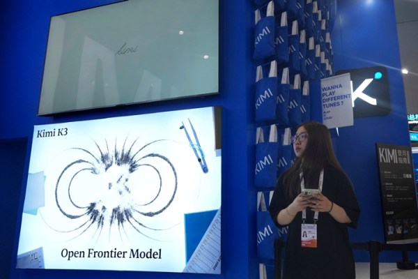 A worker stands at the booth for Chinese AI Startup Moonshot's Kimi K3 during the World AI Conference in Shanghai, China on July 17, 2026. 