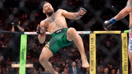 Conor McGregor lands awkwardly after trying to kick Max Holloway at the start of their welterweight fight during UFC 329 Saturday, July 11, 2026, in Las Vegas. (Steve Marcus/Las Vegas Sun via AP)