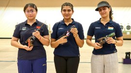 Esha Singh(centre) after winning the title in 25m pistol final in ISSF World Cup in China on Monday. Manu Bhaker (right) won bronze. (ISSF).