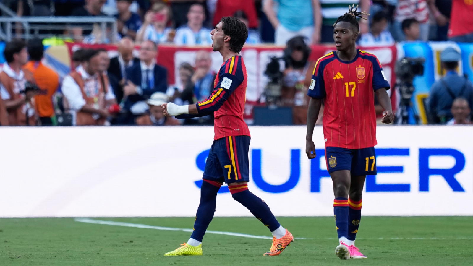 Spain's Ferran Torres, left, celebrates next to Nico Williams after scoring the opening goal during the World Cup final soccer match between Spain and Argentina in East Rutherford, N.J., near New York, Sunday, July 19, 2026. (AP Photo/Ashley Landis)