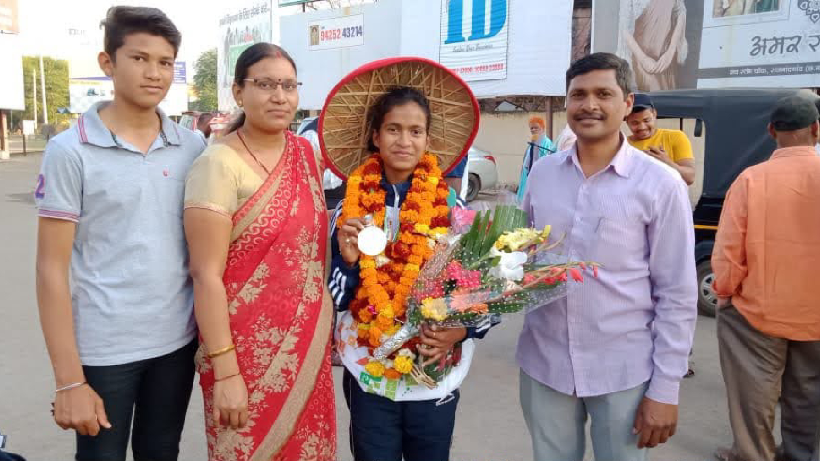 Gyaneshwari Yadav with parents Deepak Yadav and Durga Yadav. Deepak Yadav winning a bodybuilding title in his younger days. Special arrangement