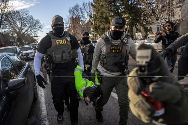 Federal agents arrest a protester during an active immigration enforcement operation in a Minneapolis neighborhood, Jan. 13, 2026. (David Guttenfelder/The New York Times)
