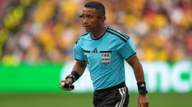 Referee Ivan Barton holds paint spray during the World Cup round of 16 soccer match between Switzerland and Colombia in Vancouver, British Columbia, Tuesday, July 7, 2026. (AP Photo/Abbie Parr)