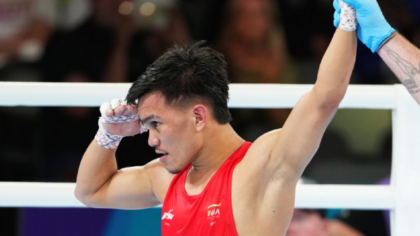 India's Jadumani Singh celebrates after winning a men's 55kg quarterfinal boxing match against Zambia's Mwengo Mwale at the 23rd Commonwealth Games, in Glasgow, Scotland, Tuesday, July 28, 2026.