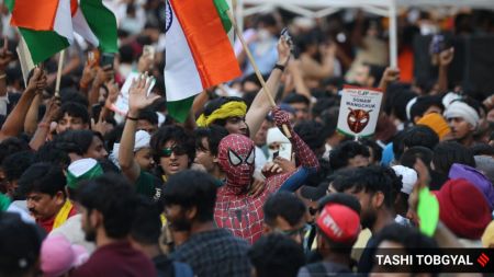 Large crowds have gathered at the Parliament Street-Tolstoy Marg crossing, with the gathering swelling towards Connaught Place in central New Delhi. (Express Photo by Tashi Tobgyal)