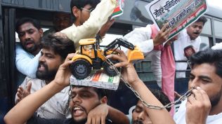Samajwadi Party Youth wing workers hold a protest against state government on Mohammad Ali Jauhar University, demolition order, in front of state assembly in Lucknow on Monday. (Express Photo by Vishal Srivastav)