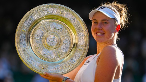 Linda Noskova of Czech Republic poses with the trophy after winning against Karolina Muchova of Czech Republic in the women's singles final at Wimbledon Tennis Championships in London, Saturday, July 11, 2026. (AP Photo)