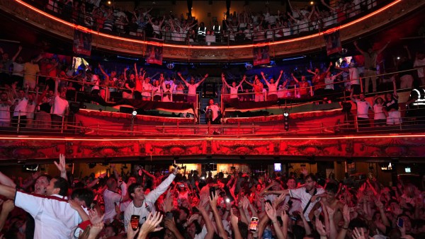Fans celebrate England's win following a screening of the World Cup 2026 quarterfinal match vs Norway at The Clapham Grand in London. (AP)