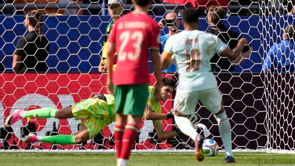 Morocco goalkeeper Yassine Bounou dives to stop a penalty shot by France's Kylian Mbappe, right, during the World Cup quarterfinal soccer match between France and Morocco in Foxborough, Mass., near Boston, Thursday, July 9, 2026. (AP Photo/Matt Slocum)