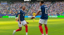 France's Kylian Mbappe (10) celebrates scoring their third goal with Michael Olise (11) during the World Cup round of 32 soccer match between France and Sweden in East Rutherford, N.J., near New York, Tuesday, June 30, 2026. (AP Photo/Pamela Smith)