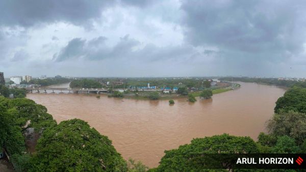 Incessant rain has significantly raised the water level at Sangam, where the Mula and Mutha rivers converge, in Pune on Tuesday. Express photographs by Arul Horizon.