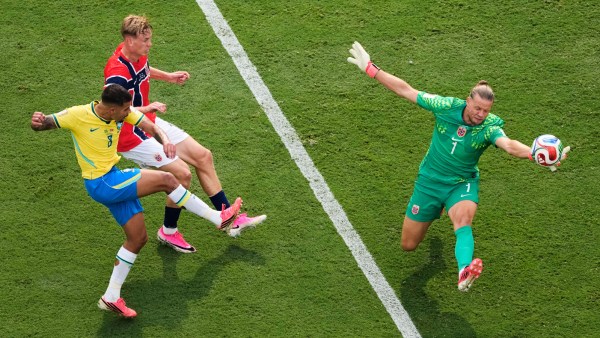 Norway goalkeeper Oerjan Nyland (1) saves a shot by Brazil's Bruno Guimaraes. (AP)