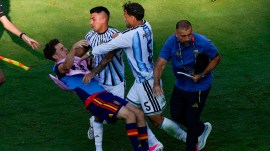 Spain's Gavi, left, falls as he scuffles with Argentina's Leandro Paredes (5) and Thiago Almada during the World Cup final soccer match between Spain and Argentina in East Rutherford, N.J., near New York, Sunday, July 19, 2026. (AP Photo/Yuki Iwamura)