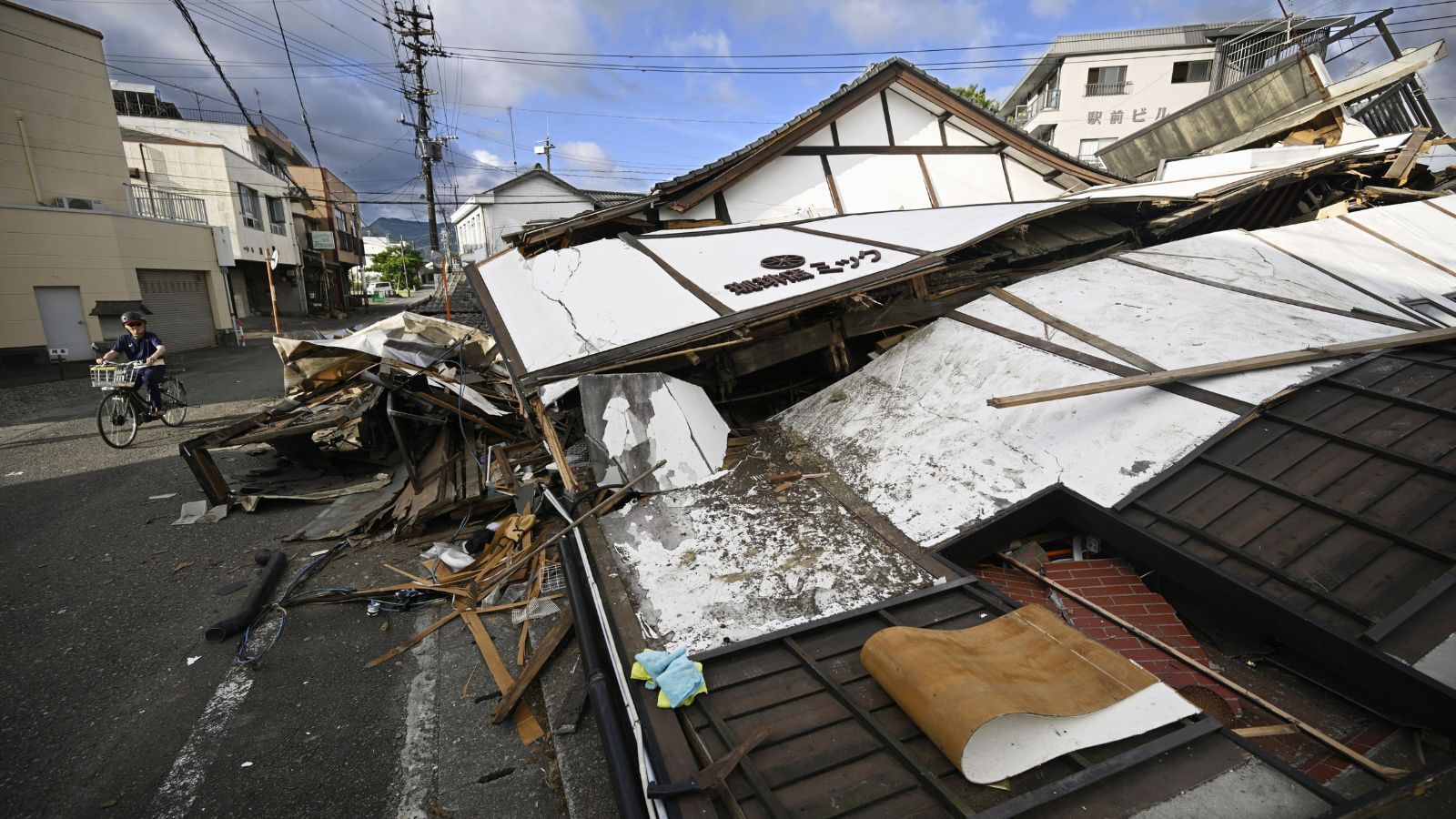 Japan earthquake death toll rises to 13 as rescuers search for missing
