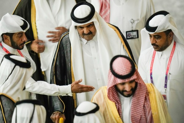 Former Emir of Qatar Sheikh Hamad bin Khalifa Al Thani, centre, arrives before the start of the World Cup group A soccer match between Qatar and Ecuador at the Al Bayt Stadium in Al Khor, Qatar, Nov. 20, 2022.