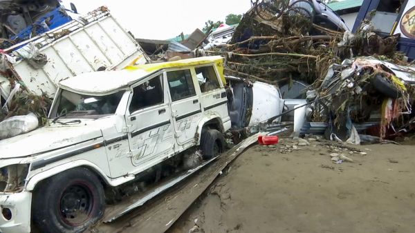 Severe flooding caused by continuous heavy rainfall wreaked havoc, leaving several vehicles overturned and badly damaged amid debris and muddy water, in Rajouri on Sunday. (ANI Video Grab)