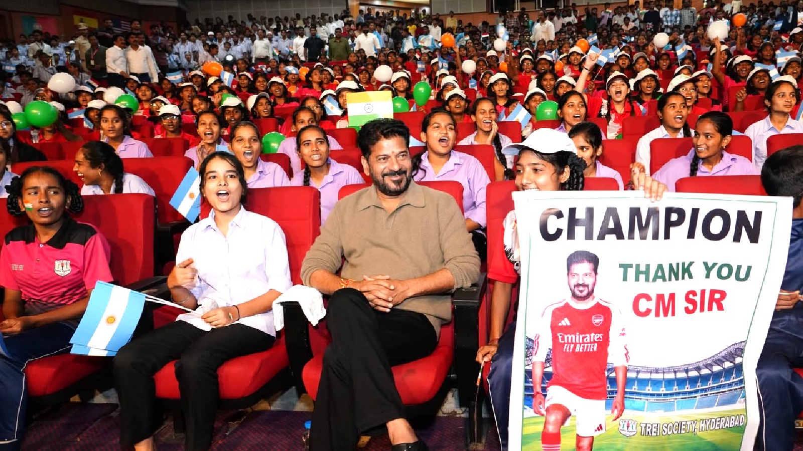 Welfare school children watching Lionel Messi's Argentina vs Egypt match with Telangana CM Revanth Reddy