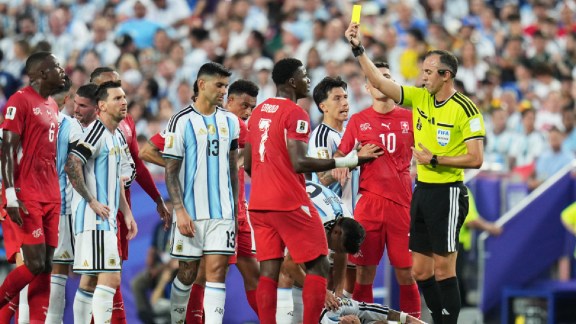 Referee Joao Pedro Silva Pinheiro, of Portugal, shows a yellow card to Switzerland's Breel Embolo (7) during the World Cup quarterfinal soccer match in Kansas City, Mo., Saturday, July 11, 2026. (AP Photo/Jeff Roberson)