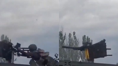 Another soldier standing inside the truck narrowly avoids being hit
