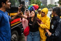 Police detain protestors as they come to participate in a demonstration at Shivaji park