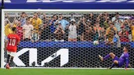 Egypt's Mohamed Salah (10) scores a panenka penalty in a shootout in the World Cup round of 32 soccer match against Egypt in Arlington, Texas, near Dallas, Friday, July 3, 2026. (AP Photo/Julio Cortez)