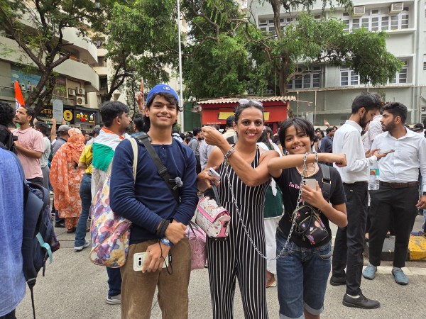 Shoiba Shaikh, 40, chained at the wrist to her 13-year-old daughter Zoya at the protest at Shivaji Park, Dadar, on Friday. "This is so that she does not get lost or stuck in a situation," she said. (Express photo)