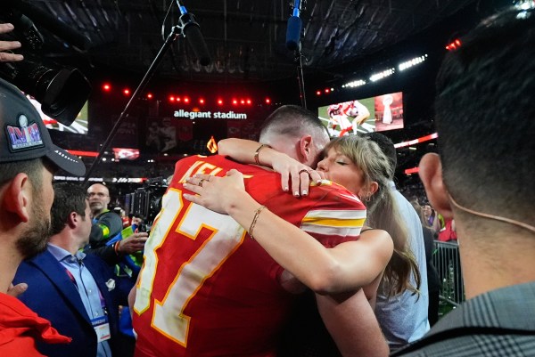 FILE - Taylor Swift embraces Kansas City Chiefs tight end Travis Kelce after the Chiefs won the NFL Super Bowl 58 football game against the San Francisco 49ers in Las Vegas on Feb. 11, 2024. (AP Photo/Julio Cortez, File)