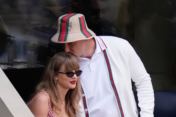 FILE - Taylor Swift gets a kiss from Kansas City Chiefs' Travis Kelce as they arrive to watch the men's singles final of the U.S. Open tennis championships in New York on Sept. 8, 2024. (AP Photo/Frank Franklin II, File)
