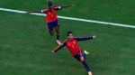 Spain's Ferran Torres (7) celebrates scoring their first goal with Nico Williams (17) during the World Cup final soccer match between Spain and Argentina in East Rutherford, N.J., near New York, Sunday, July 19, 2026. (AP Photo/Yuki Iwamura)