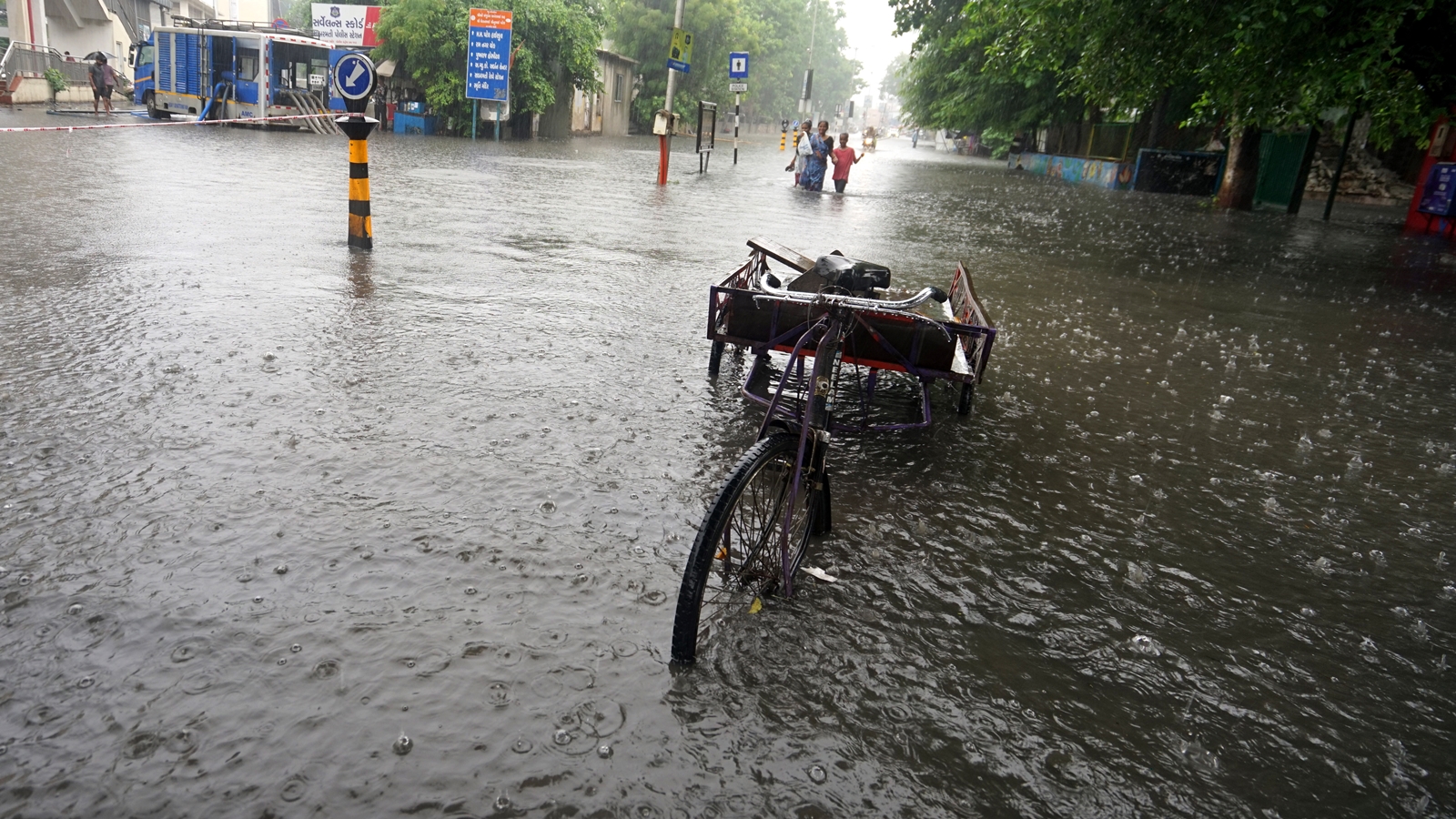 Rain havoc continues in South Gujarat: Woman killed in landslide in Valsad, 2 men swept away in Navsari Rain havoc continues in South Gujarat: Woman killed in landslide in Valsad, 2 men swept away in Navsari