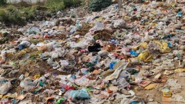 Before AI: A mound of garbage dumped near Gurgaon’s Kherki Daula Village. (Express Photo)
