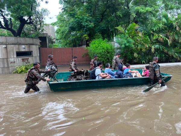 Ahmedabad Fire and Emergency Services (AFES) and Indian Army rescue efforts in Ambli-Bopal suburbs of Ahmedabad.