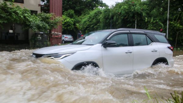 Waterlogging at Ambli Bopal road Sentosa Park in Ahmedabad on Friday. EXPRESS PHOTO BY BHUPENDRA RANA 