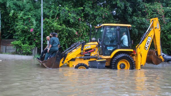 Waterlogging at Ambli Bopal road Sentosa Park in Ahmedabad on Friday. (Express Photo by Bhupendra Rana)
