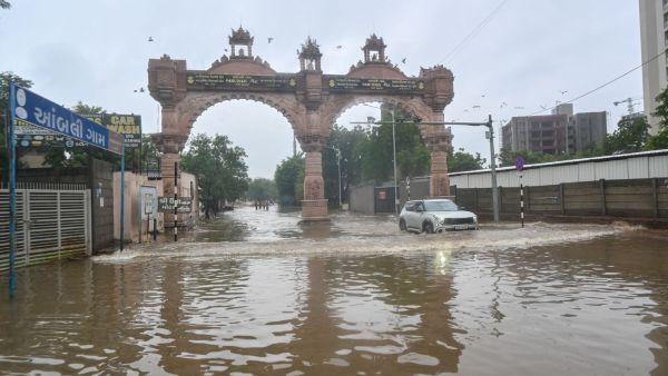 Waterlogging near Bopal area in Ahmedabad on Friday. (Express Photo by Bhupendra Rana)