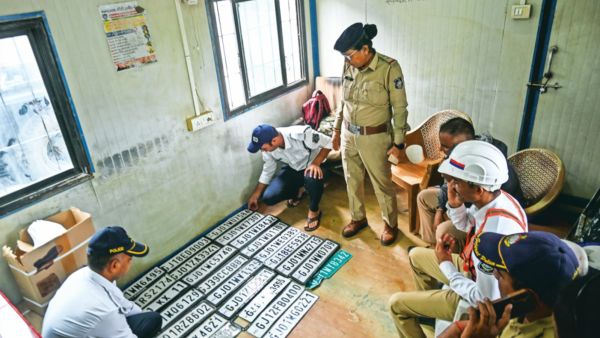 Citizens can contact the nearest traffic police station to obtain the number plate of their vehicles that have lost/fallen during heavy rains in Ahmedabad, officials said. (Express Photo by BHUPENDRA RANA) 