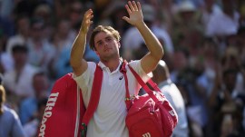 Arthur Fery of Britain waves to the audience as he leaves after winning his match against Flavio Cobolli of Italy in their quarter-final men's singles match at the Wimbledon Tennis Championships in London, Wednesday, July 8, 2026. (AP Photo/Brian Inganga)