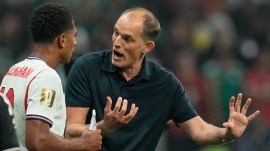 England head coach Thomas Tuchel speaks with Jude Bellingham during the World Cup round of 16 soccer match between Mexico and England in Mexico City, Sunday, July 5, 2026. (AP Photo)