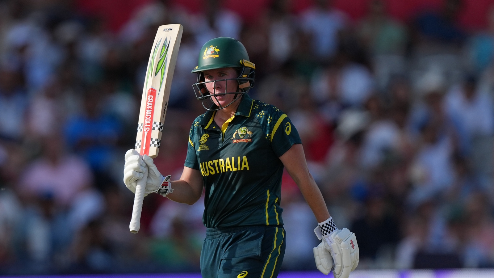 Australia's Beth Mooney, celebrates getting 50 not out during the Women's T20 Cricket World Cup final between England and Australia in London, Sunday, July 5, 2026. (AP Photo/Alastair Grant)