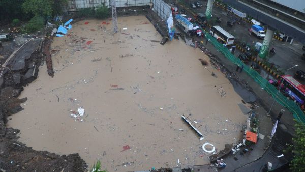 A large stretch of the road caved in on LBS Marg near Sonapur and opposite Asian Paints in Bhandup (West) (Express Photo by Akash Patil)
