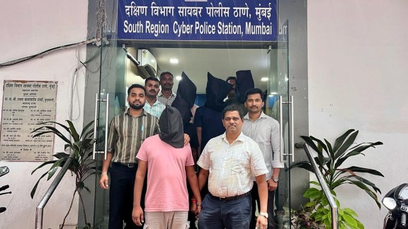 boss scam accused at police station